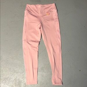 Pink leggings with pockets and velvet on the sides